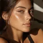 Close-up of smooth, radiant skin in warm natural light, the kind of glow a chemical peel is designed to reveal