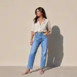 Confident woman in casual attire standing in natural light, representing a total body transformation patient's journey