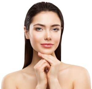 Woman with full round cheeks and lips enjoys the benefits of facial fat grafting for volume enhancement.